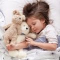 https://www.shutterstock.com/nl/image-photo/sweet-little-girl-sleeping-toys-crib-1540974275